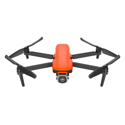 Front view of orange Autel EVO Lite drone in flight with camera and propellers extended
