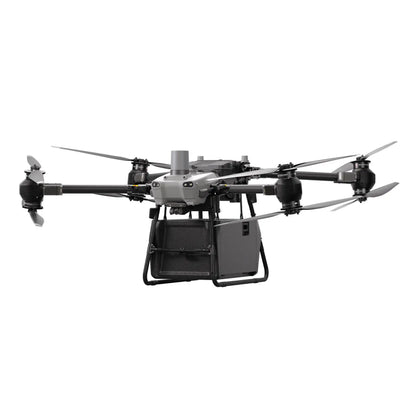 DJI FlyCart 30 delivery drone flying over water with cargo compartment