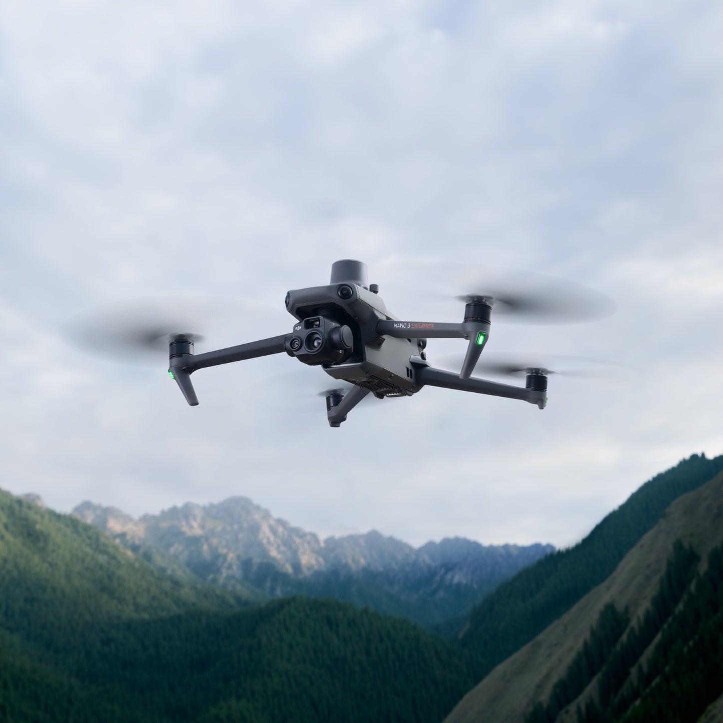 DJI Mavic 3E drone in flight over mountains for high-altitude surveying